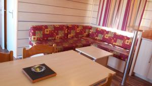 a living room with a couch and a table at La Canardiere in Casta