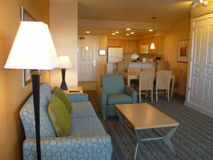 a living room with a couch and a table at Seaside Ocean Front Condo in Seaside