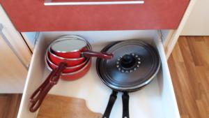 a kitchen drawer with a cooking utensils in it at La Canardiere in Casta