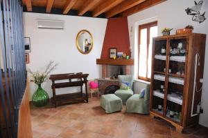 a living room with a piano and a room with a room at Agriturismo Lizzarola in Peschiera del Garda
