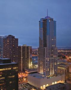 a city at night with tall buildings and skyscrapers at Four Seasons Hotel Denver in Denver