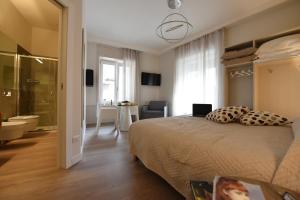 Ένα ή περισσότερα κρεβάτια σε δωμάτιο στο Nicola's Luxury Rooms