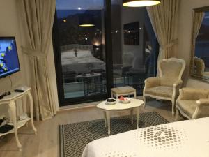 TV a/nebo společenská místnost v ubytování Apartment Sunset + 28 fotografií