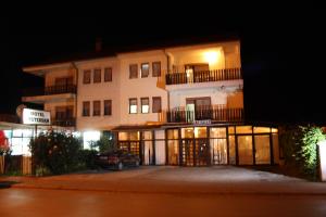 a building with a car parked in front of it at Villa Amsterdam in Ohrid
