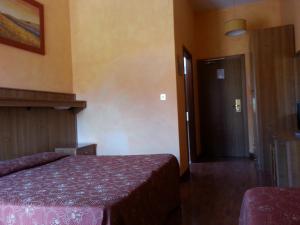 Ліжко або ліжка в номері Hotel Tempio di Apollo