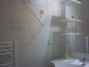 a bathroom with a sink and a shower at Ana Rooms in Krk