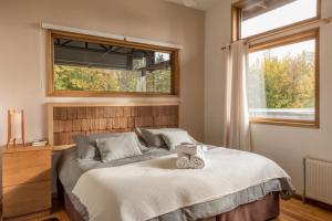 מיטה או מיטות בחדר ב-Patagonia House
