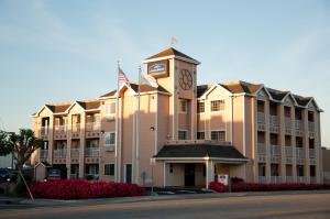 a large building with a clock tower on top of it at Howard Johnson by Wyndham Salinas in Salinas