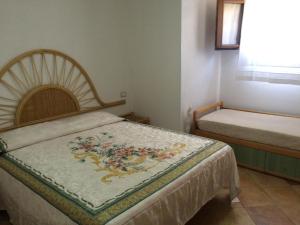 A bed or beds in a room at Villa Scalea