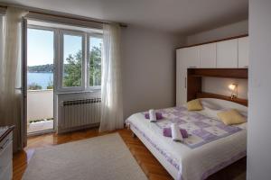 Postel nebo postele na pokoji v ubytování Apartments Maris