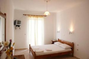 Postel nebo postele na pokoji v ubytování Santas Rooms