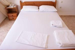 Postel nebo postele na pokoji v ubytování Santas Rooms
