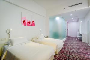 Postel nebo postele na pokoji v ubytování Pegasus Hotel Shah Alam