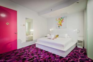 Postel nebo postele na pokoji v ubytování Pegasus Hotel Shah Alam