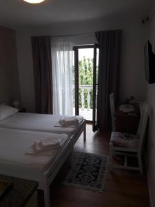 Postel nebo postele na pokoji v ubytování Roza Guest House