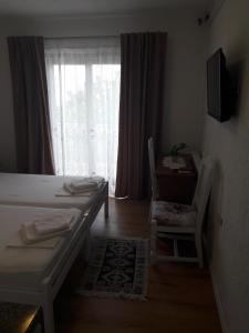 TV a/nebo společenská místnost v ubytování Roza Guest House