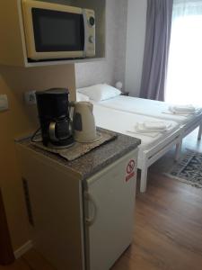 Postel nebo postele na pokoji v ubytování Roza Guest House