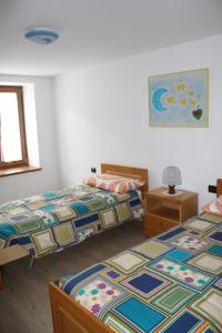 Postel nebo postele na pokoji v ubytování La Casa della Coccinella