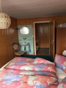 Ένα ή περισσότερα κρεβάτια σε δωμάτιο στο Hotel Hulfteggpass