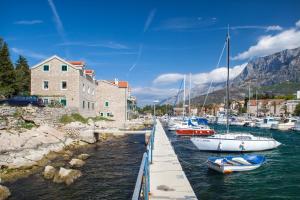a group of boats are docked in a harbor at Apartment Alen in Makarska