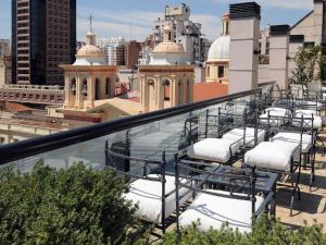 a row of chairs on the roof of a building at Windsor Hotel in Córdoba