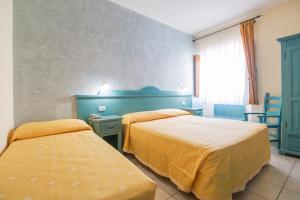 Postel nebo postele na pokoji v ubytování Hotel San Francisco