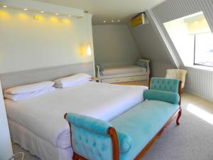 Un pat sau paturi într-o cameră la Hotel Las Terrazas Business
