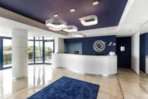 Vstupní hala nebo recepce v ubytování Ticho's Greenblu Hotel