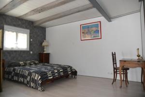 Ein Bett oder Betten in einem Zimmer der Unterkunft Relais Des Fargues