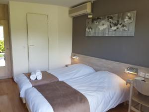 Кровать или кровати в номере Fasthôtel - Saint Emilion Est