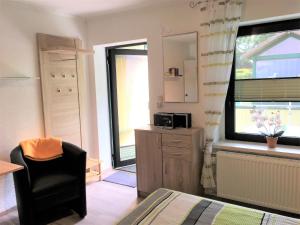 TV a/nebo společenská místnost v ubytování Haus Frohberg