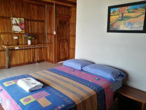 Voodi või voodid majutusasutuse Cocoa Inn Hostal toas
