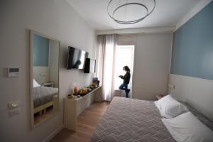 Μια τηλεόραση ή/και κέντρο ψυχαγωγίας στο Nicola's Luxury Rooms