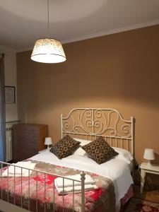 a bedroom with a bed with two pillows on it at La Fontana di Carlotta in Rome