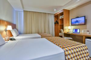 Postel nebo postele na pokoji v ubytování Sleep Inn Aeroporto de Guarulhos - São Paulo