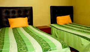 Postel nebo postele na pokoji v ubytování Hostal Aventura + 9 fotografií