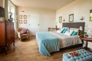 Postel nebo postele na pokoji v ubytování B&B De Vossenbarm