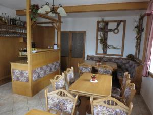 a dining room with a table and chairs at Selský dvůr 1 in Police nad Metují +32 photos