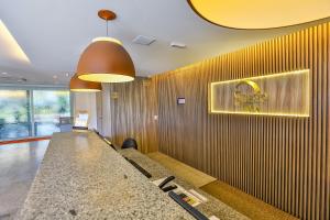a waiting room at a super max restaurant at Sleep Inn Aeroporto de Guarulhos - São Paulo in Guarulhos