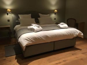 Кровать или кровати в номере B&B d'Oude Brouwerij