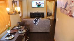 a living room with a couch and a table at Cowboy Condo in Whitefish