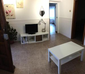 A television and/or entertainment centre at Los Pinos de Cardes