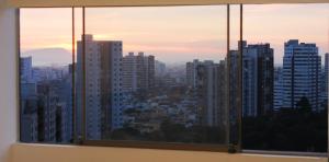 a view of a city skyline from a window at Departamento Lima in Lima +5 photos