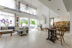 a living room with a couch and a table at Happiness Apartments in Hersonissos
