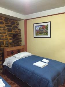 Postel nebo postele na pokoji v ubytování Rumi Sonqo Hostel