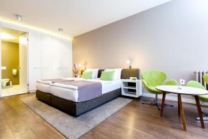 Postel nebo postele na pokoji v ubytování Adresa Suites