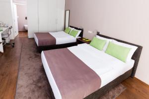 Postel nebo postele na pokoji v ubytování Adresa Suites