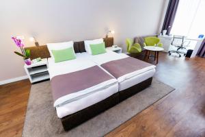 Postel nebo postele na pokoji v ubytování Adresa Suites