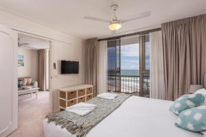 a bedroom with a large bed and a balcony at Ocean Royale in Gold Coast +111 photos