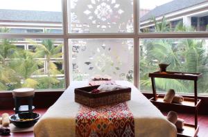 Postel nebo postele na pokoji v ubytování Golden Tulip Jineng Resort Bali